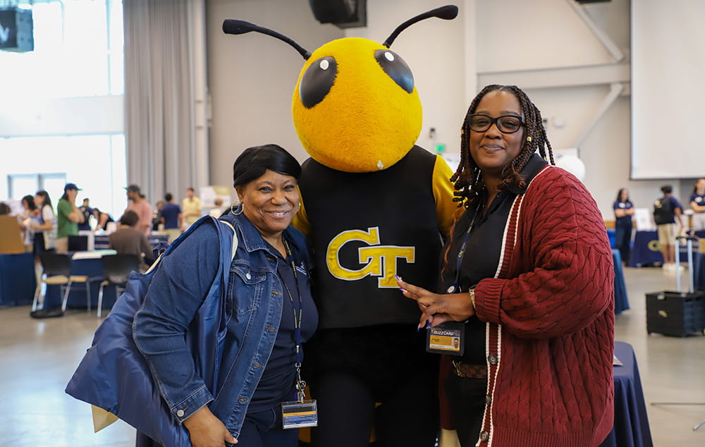 Graduate Education staff members with Buzz mascot at GradExpo